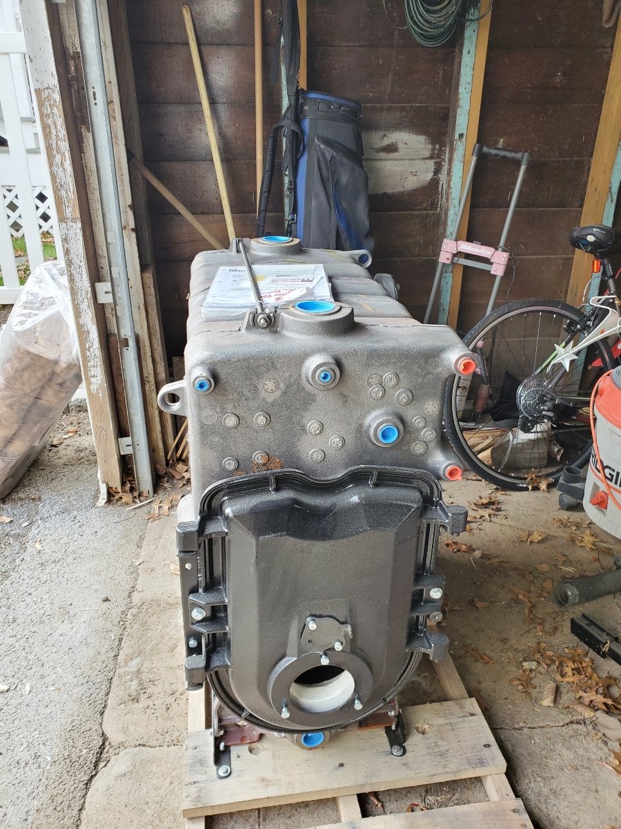 Cast iron boiler sections on a pallet before assembly