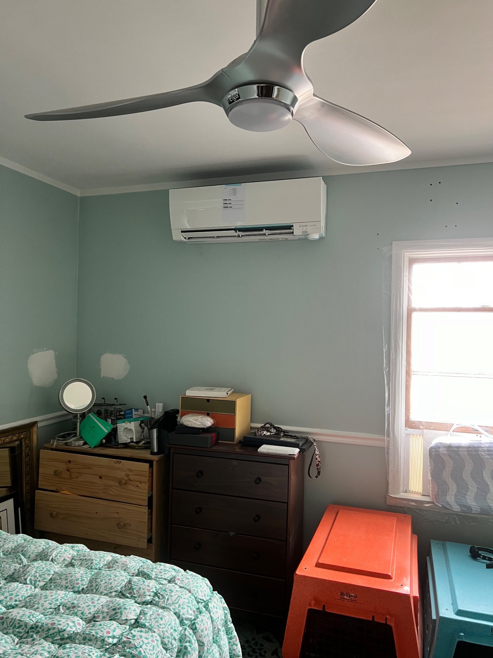 A ductless wall head installed in a bedroom