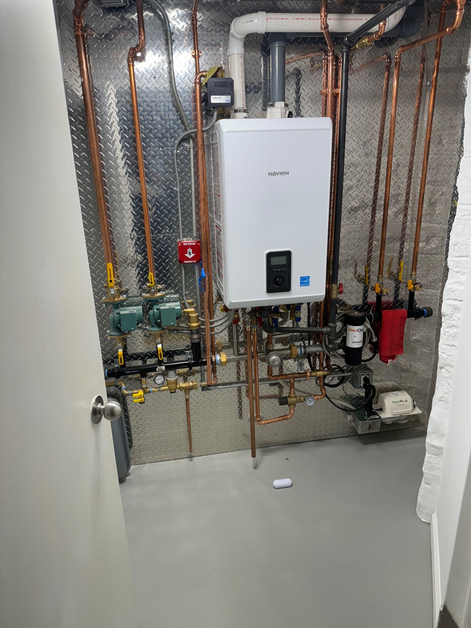 A clean combi boiler installation with copper pipework